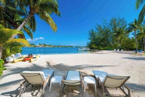 On the beach, sun loungers, beach towels