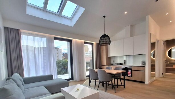 A modern apartment with a living area, dining space, and kitchen. - Apartments Onia Budva (Budva)