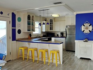 Fridge, microwave, oven, stovetop - Sunset | Coastal Home, Close to Beach, Fire Pit, Corn Hole + Outdoor Shower (Panama City Beach)