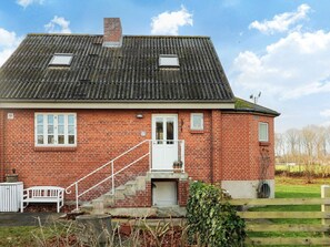 Charming single-story home with a cozy porch and inviting entrance.