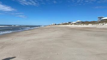 On the beach, sun-loungers