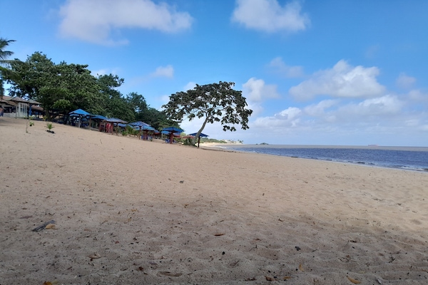 Beach nearby, white sand, beach umbrellas, beach towels