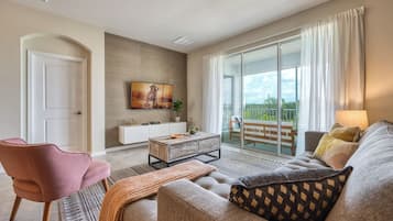 Family Apartment, Balcony | Living area | Flat-screen TV