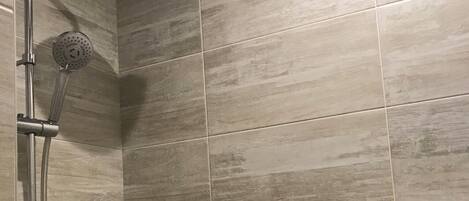 Shower, hair dryer, towels, toilet paper