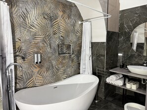 Shower, eco-friendly toiletries, hair dryer, bidet