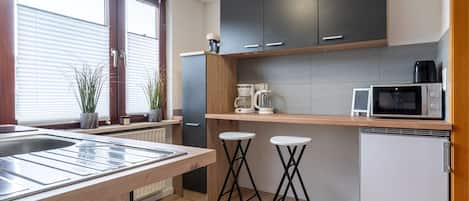 Fridge, microwave, stovetop, coffee/tea maker