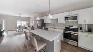 Fridge, dining tables - Landing | Chic 2BD, Pool, Gym (Willow Springs)