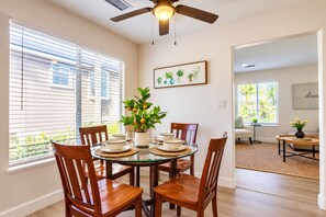 Gather around your private dining table for meals filled with warmth and laughter, surrounded by natural light and tropical touches that make every bite feel special.