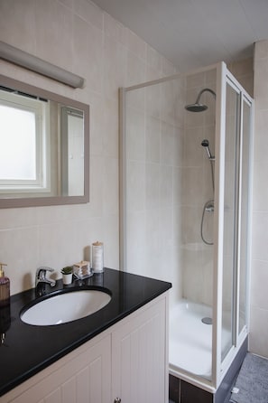 Shower, hair dryer, soap, shampoo
