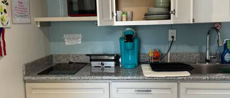 Fridge, microwave, stovetop, coffee/tea maker