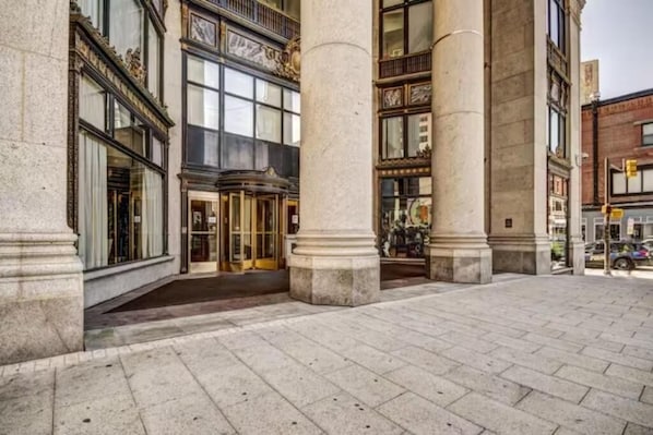 A historic building with large stone columns, ornate windows, and a grand entrance. - Fantastic 2 bedrooms apt. Harbor (Baltimore)