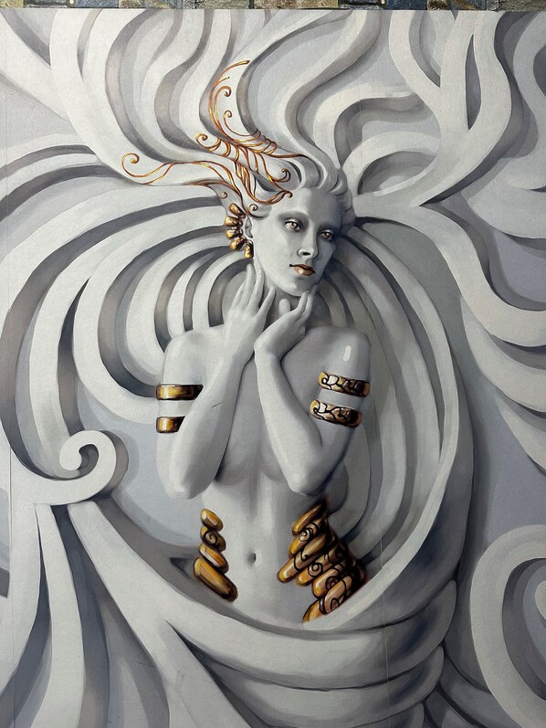 A mural of a figure with flowing hair and a serene expression. - La Dea del mare Scilla (Scilla)