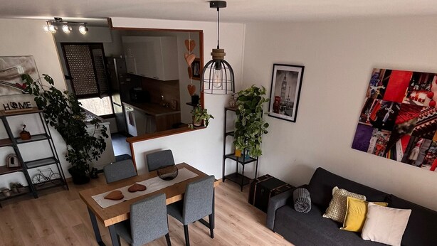 A modern living space with a dining area, sofa, and a kitchen in the background. - Close to Dijon city center, ideal for a leisure or business stay  (Dijon)