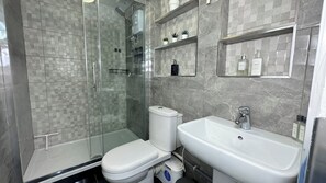 Shower, hair dryer, towels, soap