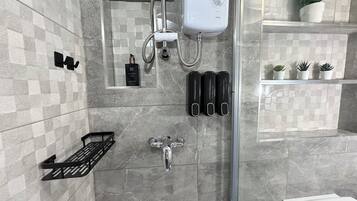 Shower, hair dryer, towels, soap