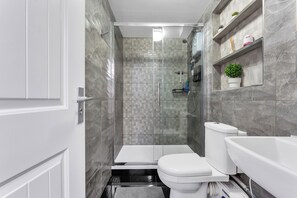 Shower, hair dryer, towels, soap