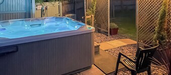 Bright spacious with a lovely garden with hot tub.