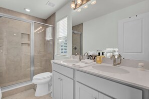 Shower, hair dryer, towels, toilet paper