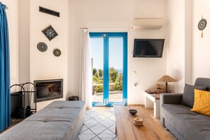 TV, fireplace - Holiday Home 'Kalliope' with Sea View, Wi-Fi and Air Conditioning (Gennadi - Rhodos - Dodekanese)