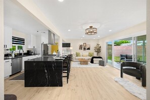 Enjoy a spacious open-plan living area with a kitchen and comfortable seating.