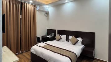Premium bedding, memory-foam beds, laptop workspace, bed sheets