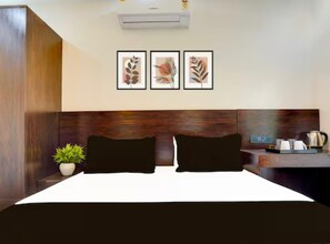Premium bedding, memory-foam beds, laptop workspace, bed sheets - Yati Suites (Greater Noida)
