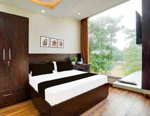 Premium bedding, memory-foam beds, laptop workspace, bed sheets