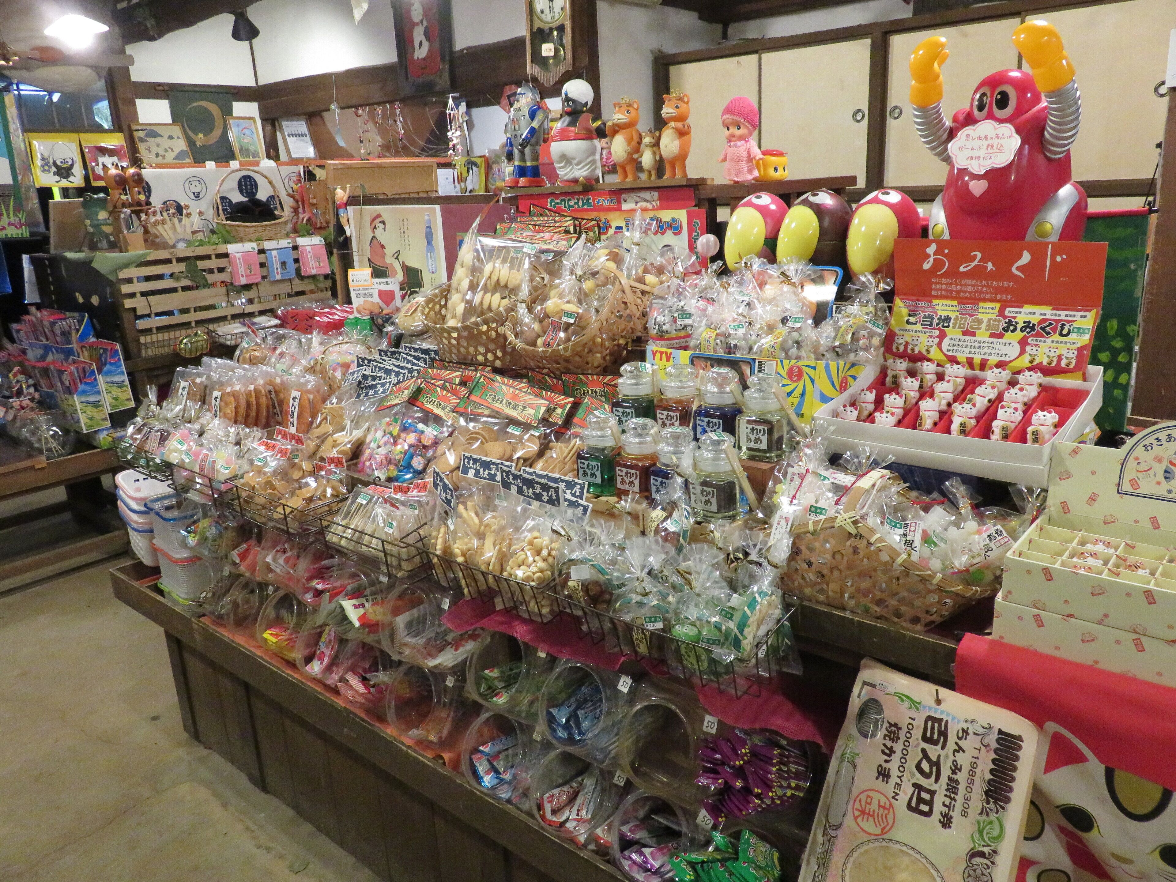 A variety of packaged goods and toys displayed in a store.