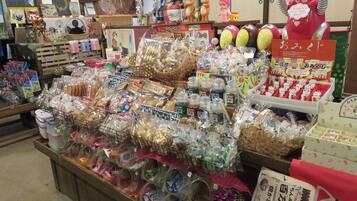 A variety of packaged goods and toys displayed in a store.