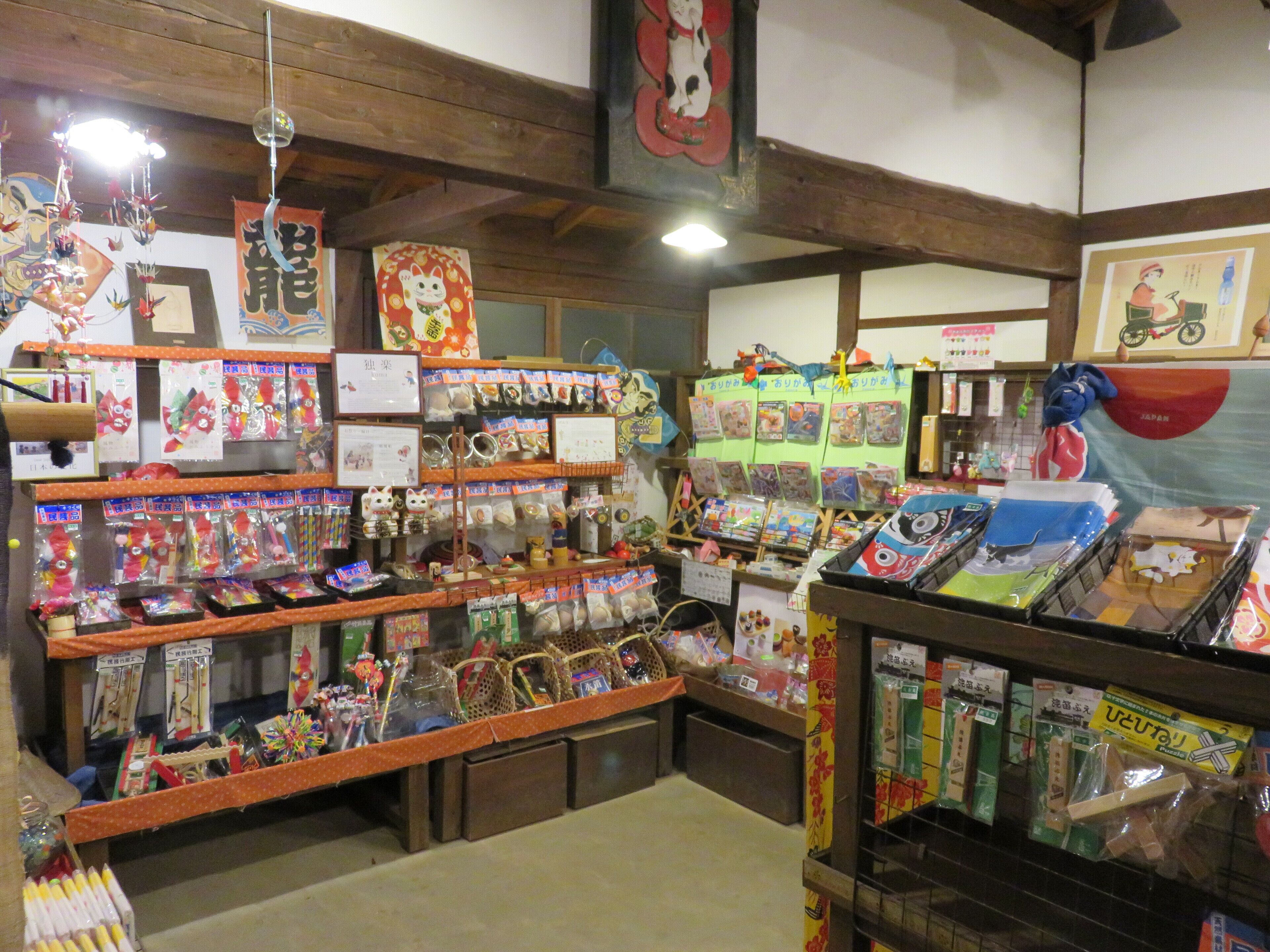 A store with shelves of various items, including toys and decorations.