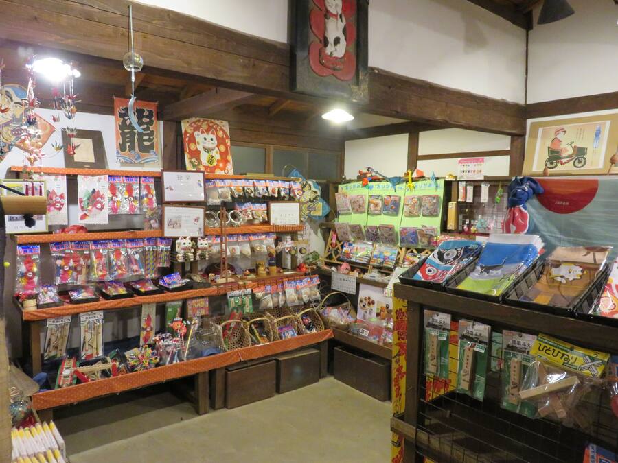 A store with shelves of various items, including toys and decorations.