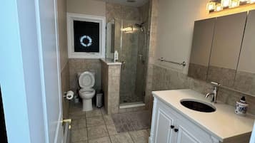 Shower, hair dryer, towels, soap