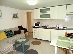 Apartment (One Bedroom Apartment with Sea View) | Private kitchen | Fridge