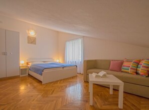 Apartment (Two Bedroom Apartment) | Living room | 32-inch flat-screen TV with satellite channels - Contemporary Crikvenica Apartments With Private Parking (Crikvenica)