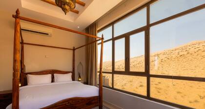 Immerse in ultimate desert elegance with the Sand Suite at Thousand Nights Camp