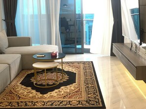 Family Apartment, 3 Bedrooms | Living area | Fireplace, printers - Eaton Residences KLCC (Kuala Lumpur)