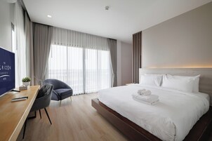 Family Quadruple Room, Park View | In-room safe, desk, laptop workspace, blackout drapes