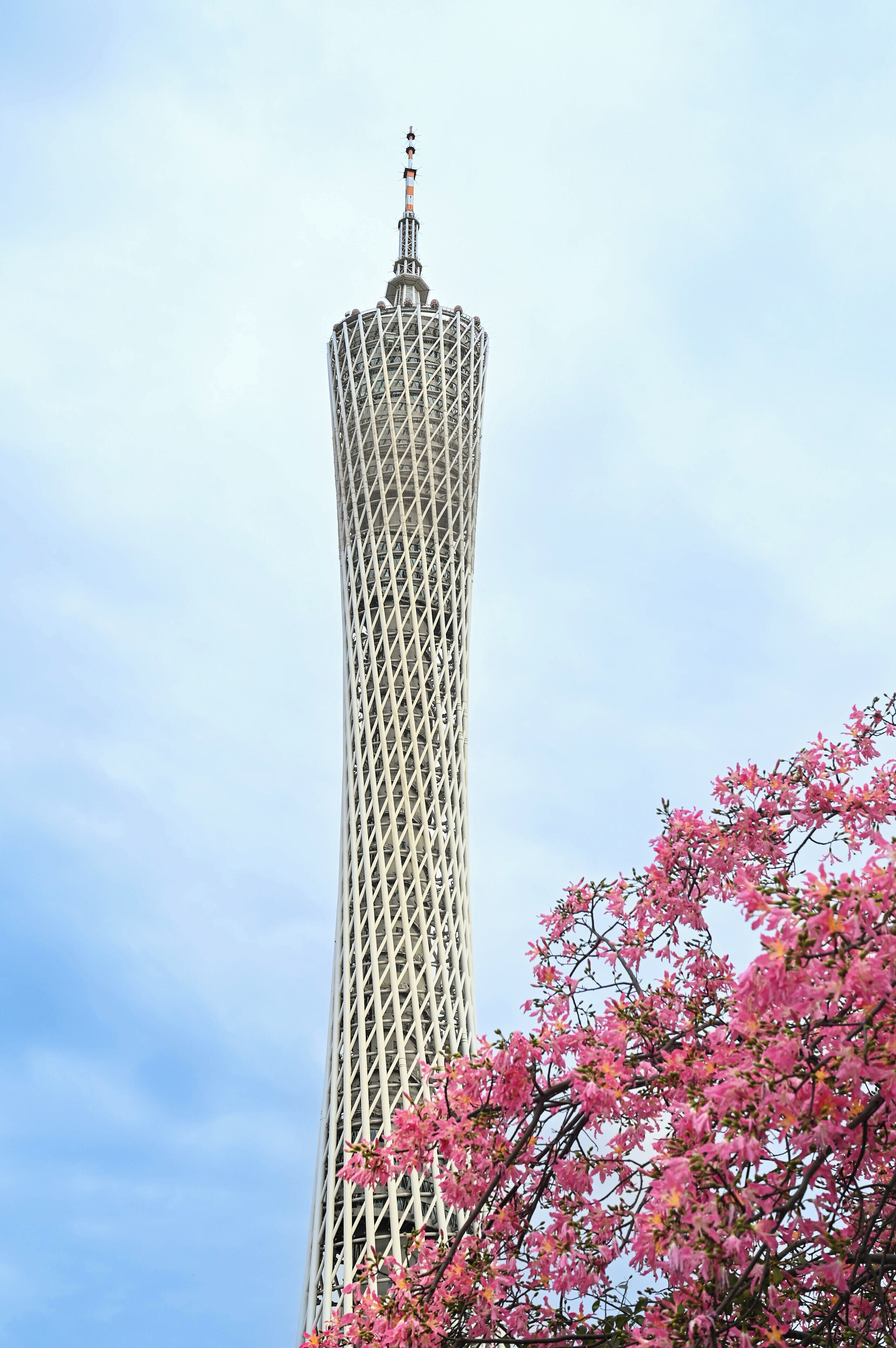 A tall, cylindrical tower with a lattice structure and a spire on top.