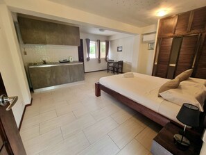 Apartment, Balcony, Garden View | 1 bedroom, desk, laptop workspace, free WiFi - Day & Night Accommodations (Daanbantayan)