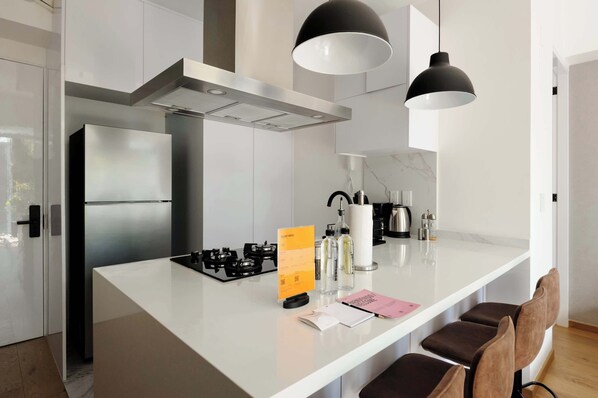 Microwave, stovetop, coffee/tea maker, toaster