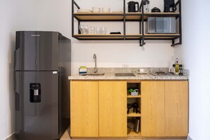 Fridge, microwave, stovetop, coffee/tea maker