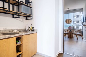 Fridge, microwave, stovetop, coffee/tea maker