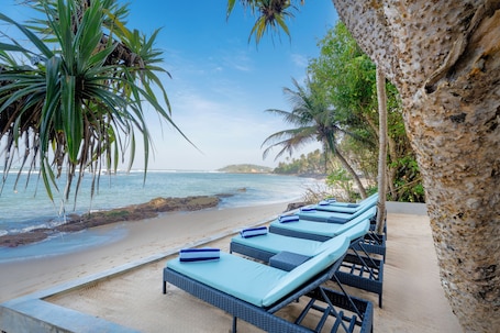 On the beach, white sand, beach bar. Sandy Bliss