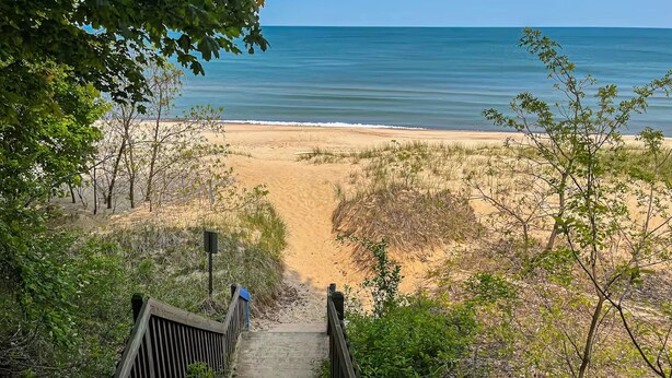 A wooden staircase leading to a beach with a clear view of the ocean. - Remodeled, Private Pool & Hot Tub, Beach Nearby (Union Pier)