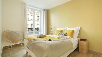 Apartment | Laptop workspace, iron/ironing board, bed sheets