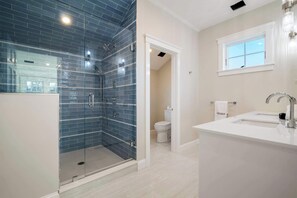 Shower, hair dryer, towels, shampoo