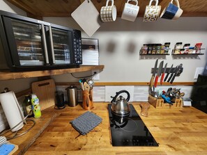 Oven, stovetop, coffee grinder, cookware/dishes/utensils