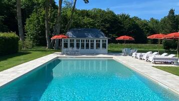 Seasonal outdoor pool, open 2:00 PM to 7:00 PM, pool umbrellas