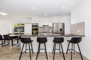 Fridge, microwave, oven, stovetop - Bayview: Three Bedroom, Family & Pet Friendly Coastal Getaway in Agnes Water (Agnes Water)