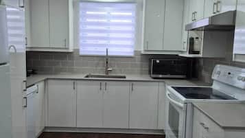 Coffee/tea maker, fridge, microwave, oven